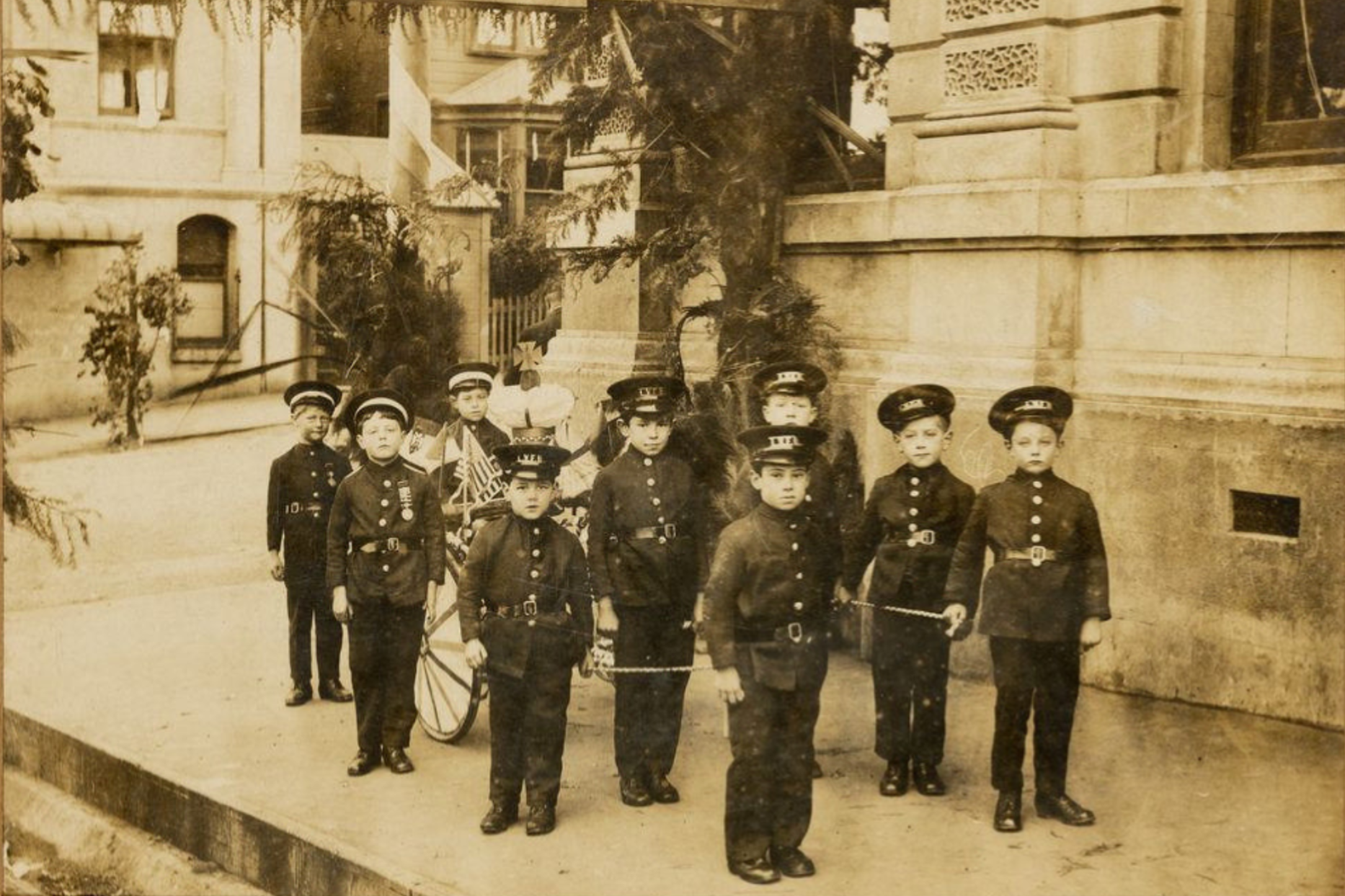 Nine young boys dressed in Lyttelton Volunteer Fire Brigade uniforms - 14978.1